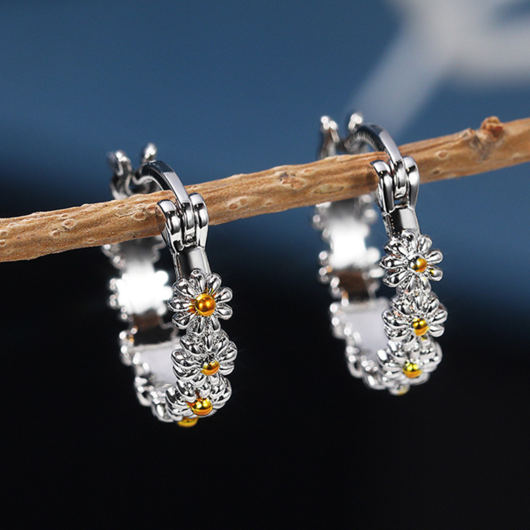 Pendientes de aro con forma de margarita fabricados en plata de ley 925